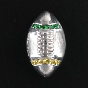 Sterling silver football pin with genuine yellow sapphire and tsavorite